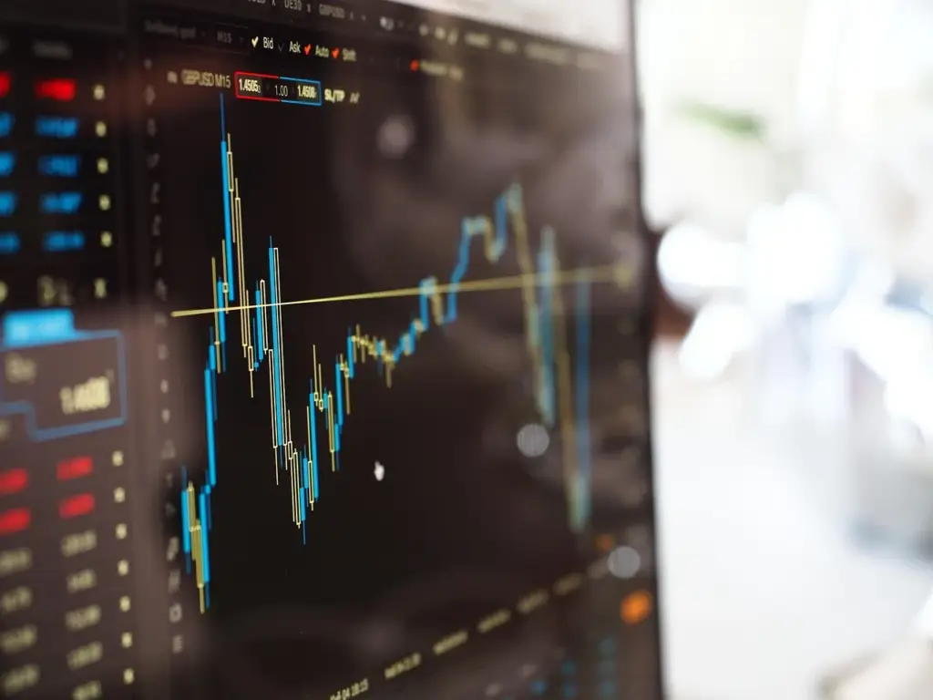 Graph with a sharp upward trend but a dollar sign in decline